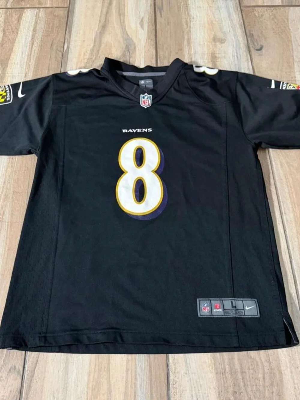 Nike Baltimore Ravens Lamar Jackson black jersey. kids size large.